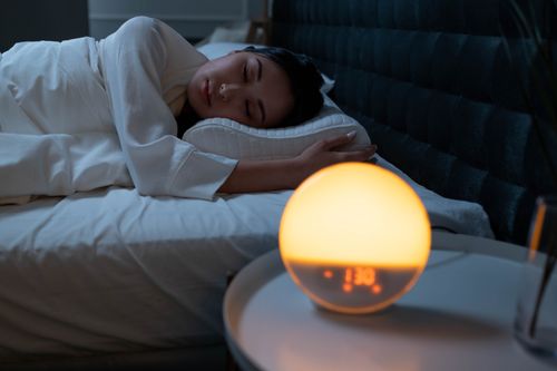 Person sleeping peacefully in a cozy bedroom